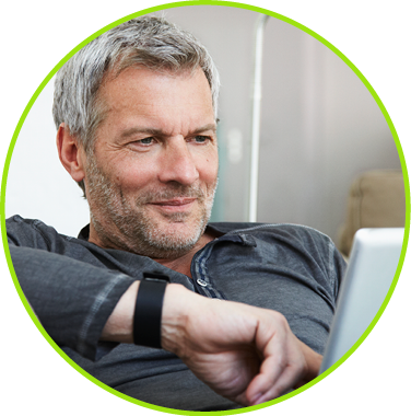 Photo of a middle-aged man using mobile tablet