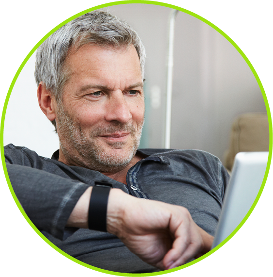 Photo of a middle-aged man using mobile tablet