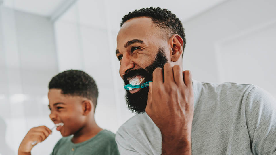 Photo of female scientist looking through a microscope
