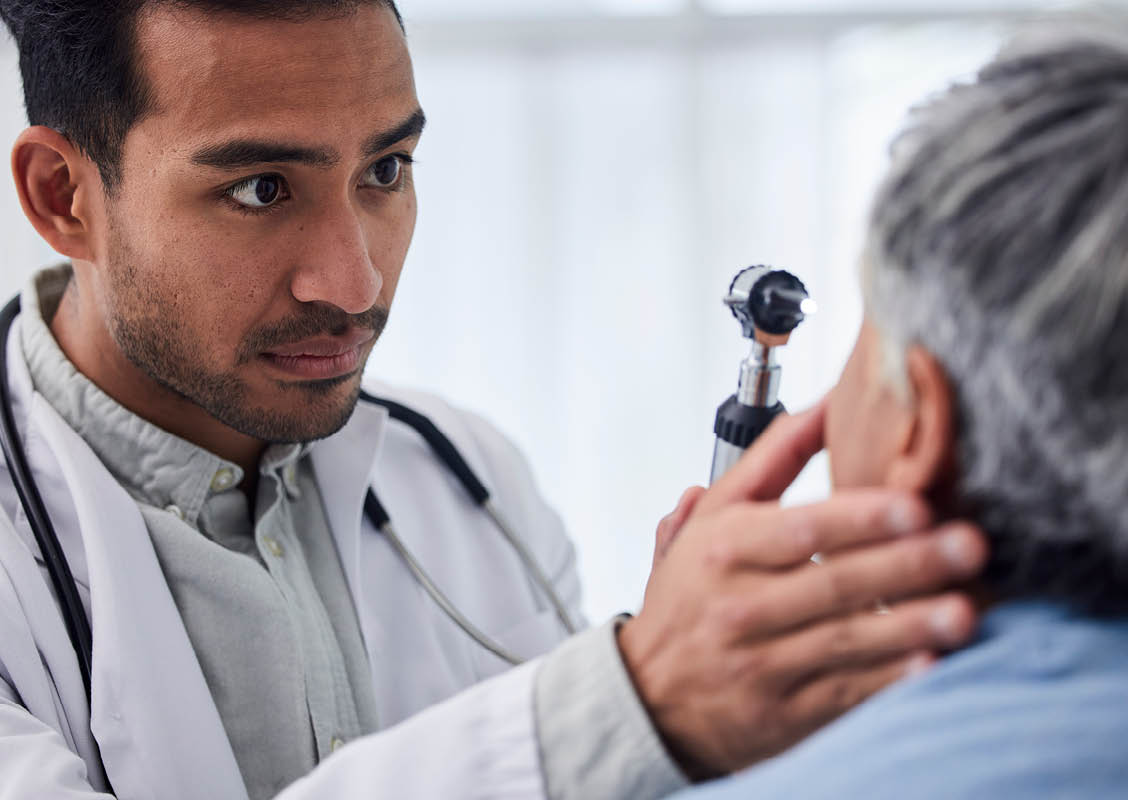 Man, doctor or old woman in eye test assessment in clinic for healthcare, wellness or vision examination. Patient, visual or client testing a mature optician or optometrist in optometry consultation