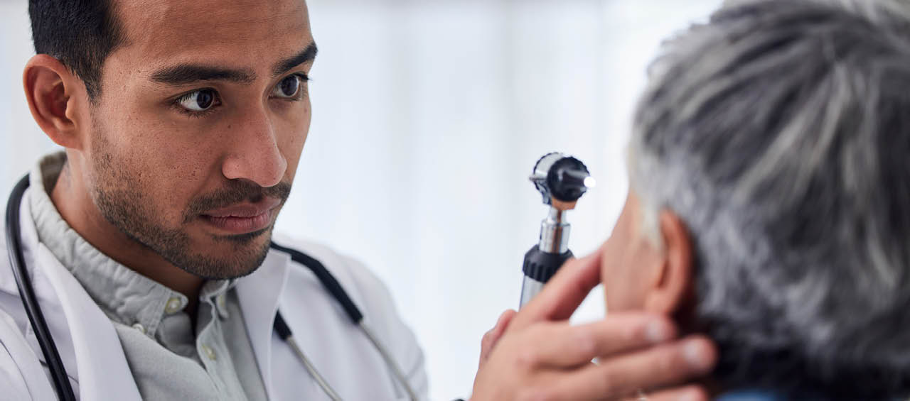 Man, doctor or old woman in eye test assessment in clinic for healthcare, wellness or vision examination. Patient, visual or client testing a mature optician or optometrist in optometry consultation