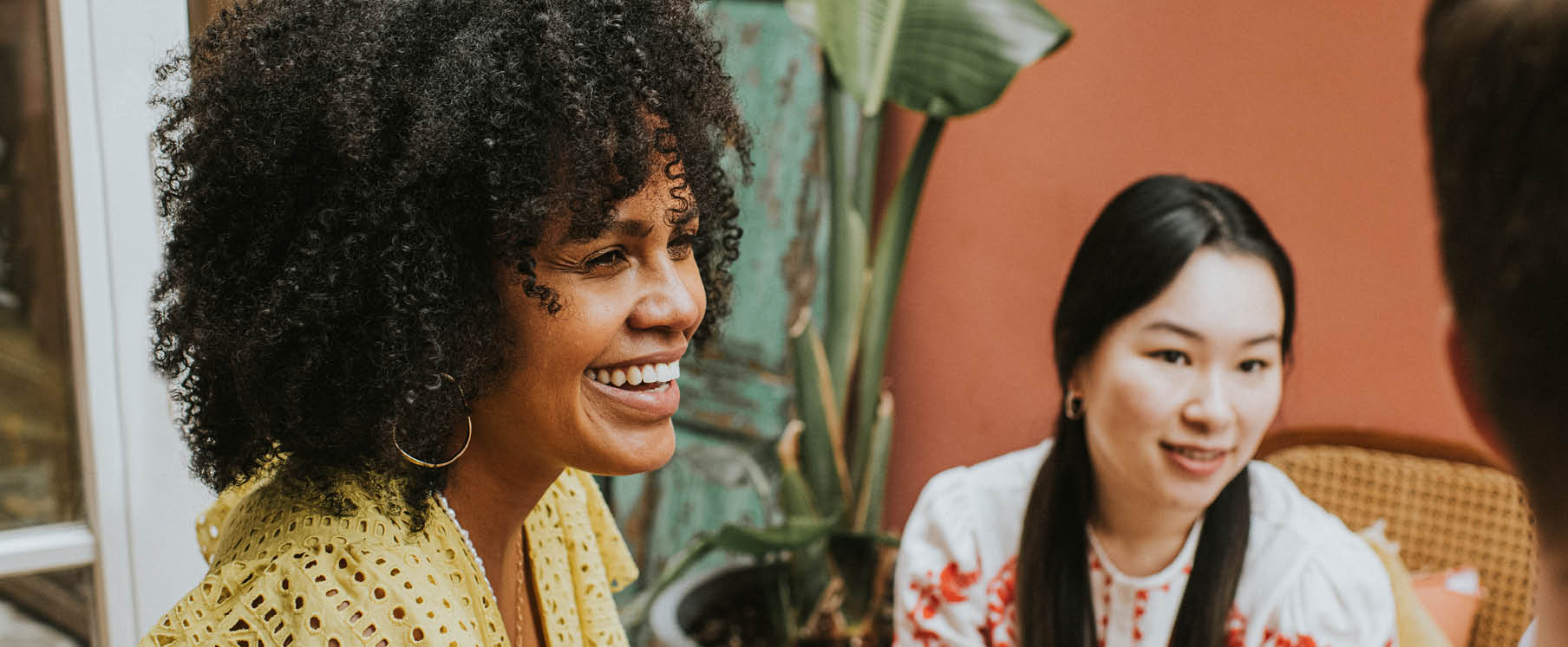 Photo of a father carrying his daughter on his shoulders