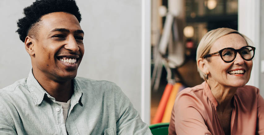 Photo of a male and female co-worker in meeting