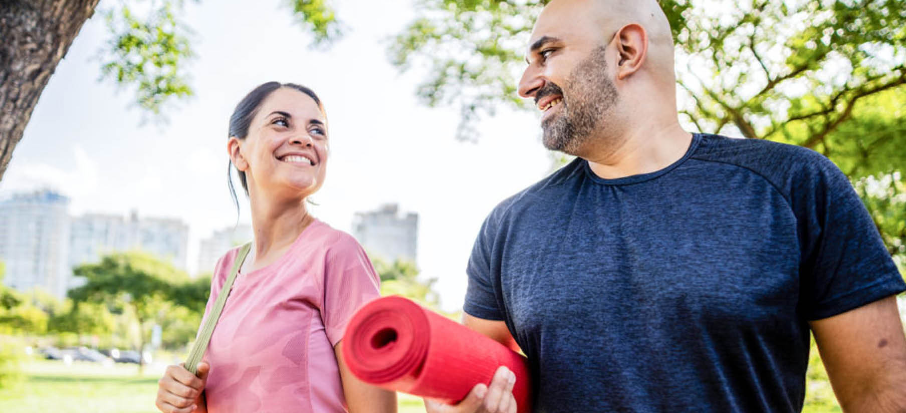 Photo of two active women looking at their smart watches