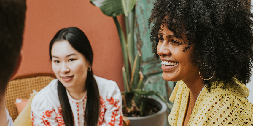 Photo of two female employees in a meeting