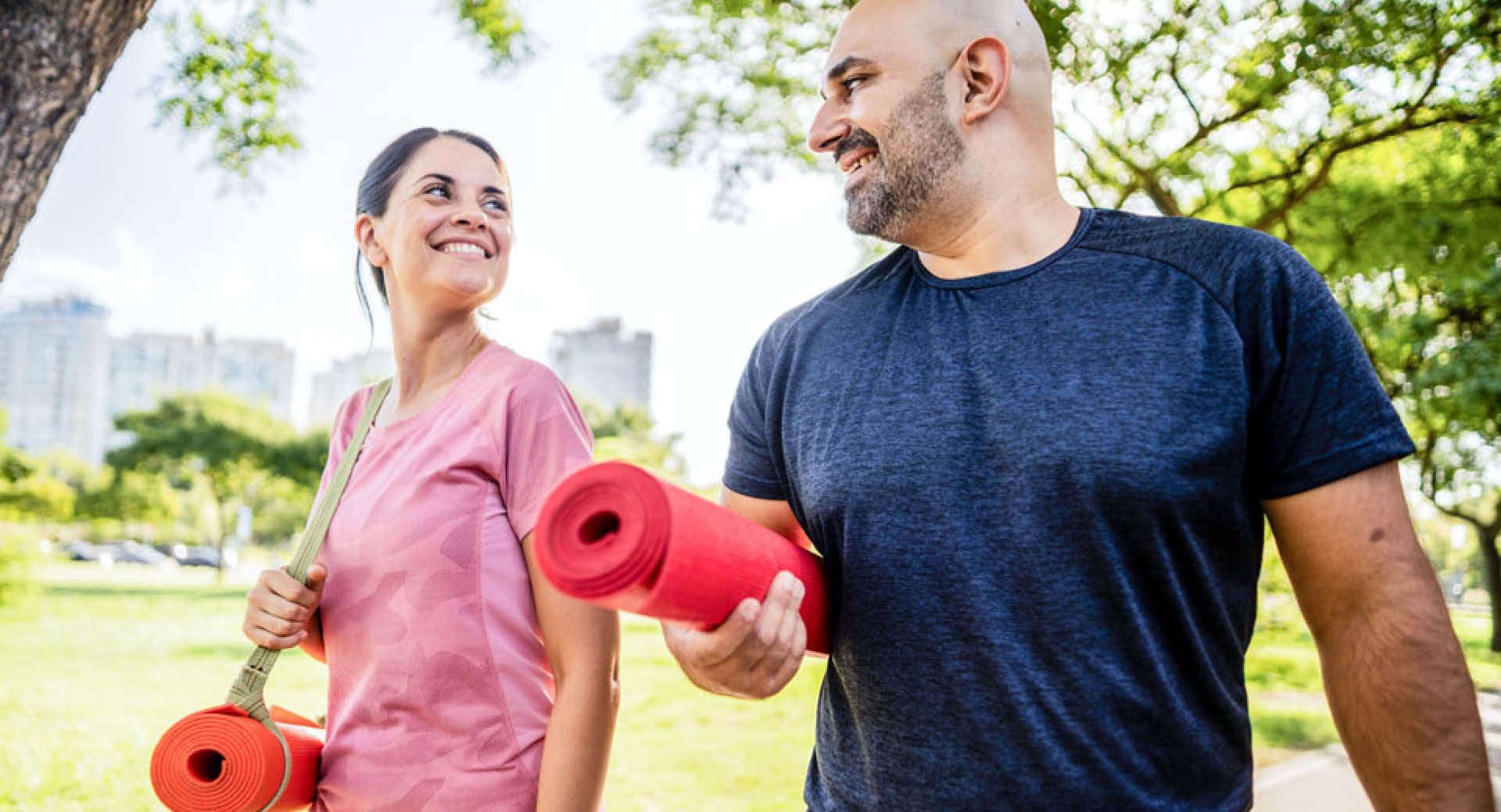 Photo of two active women looking at their smart watches