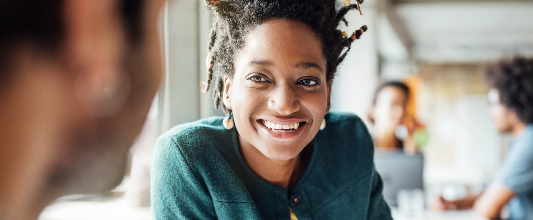 Photo of a father carrying his daughter on his shoulders