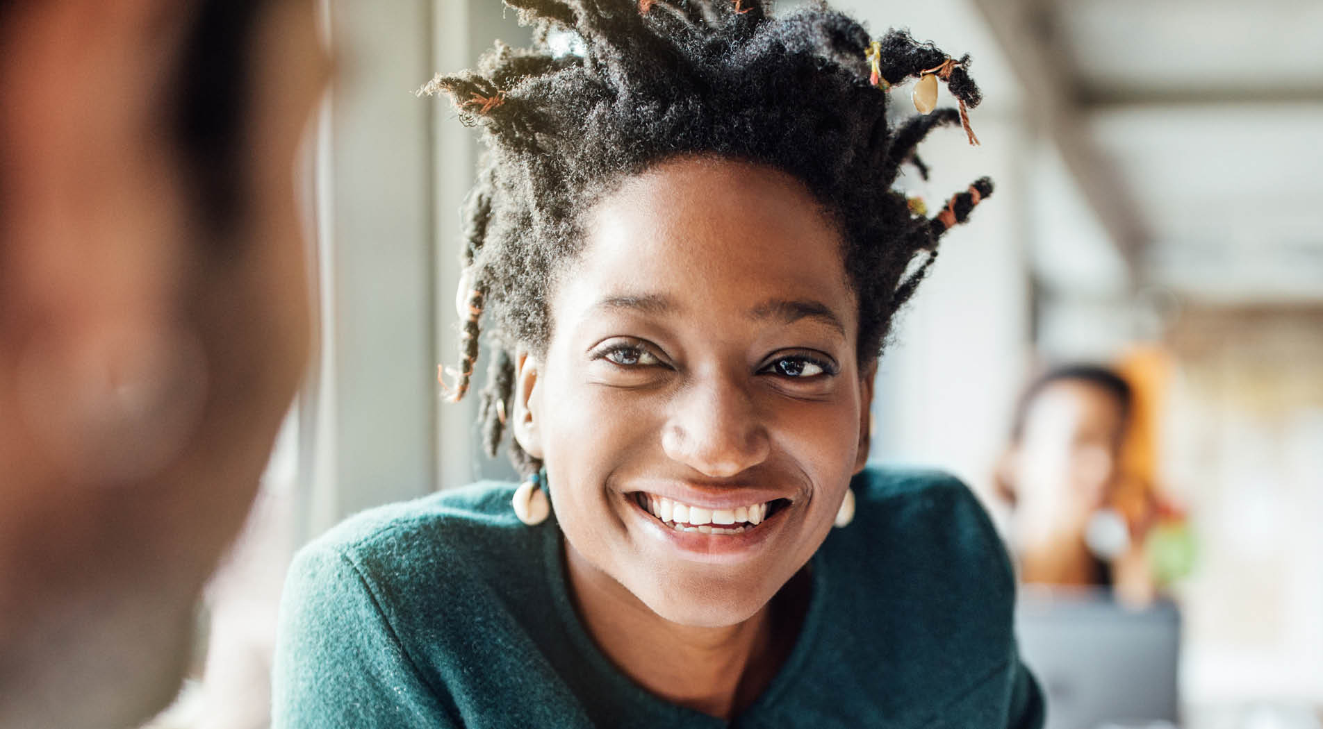 Photo of African American woman in meeting