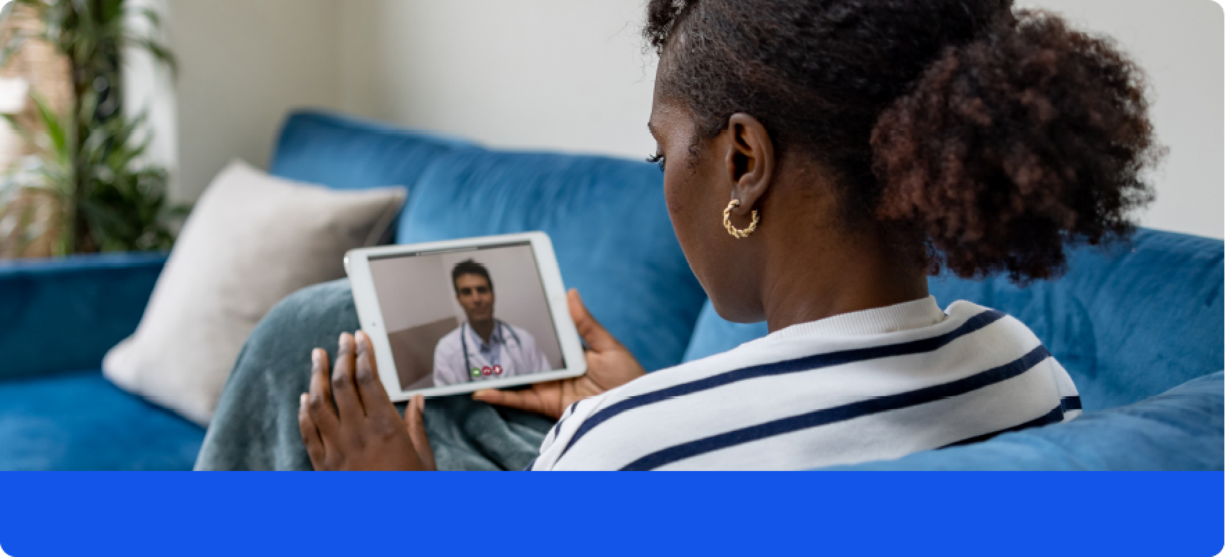Photo of a young woman speaking to a doctor on her mobile device.